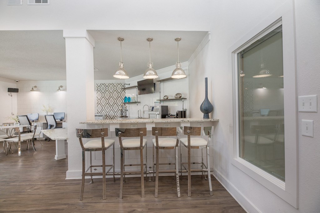 a kitchen with a bar and stools in a living room  at Butternut Ridge, Ohio, 44070