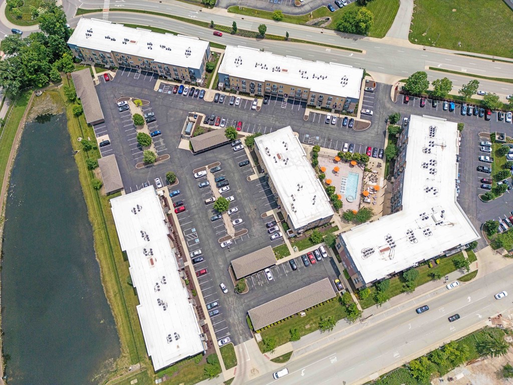 A parking lot with a building in the background.