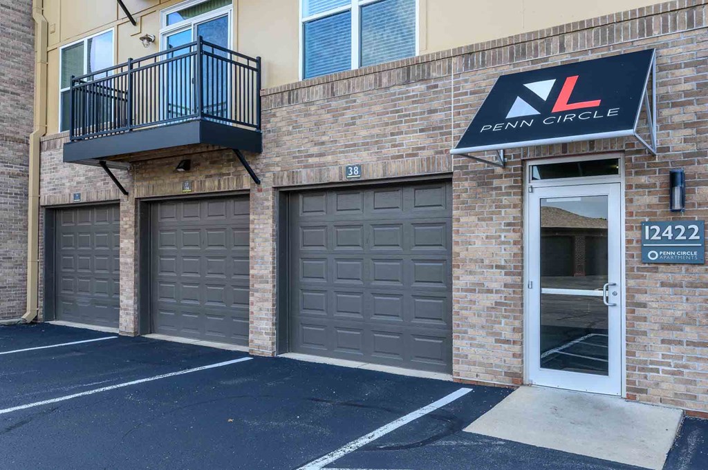 A building with a balcony and a sign that reads "Penn Circle."