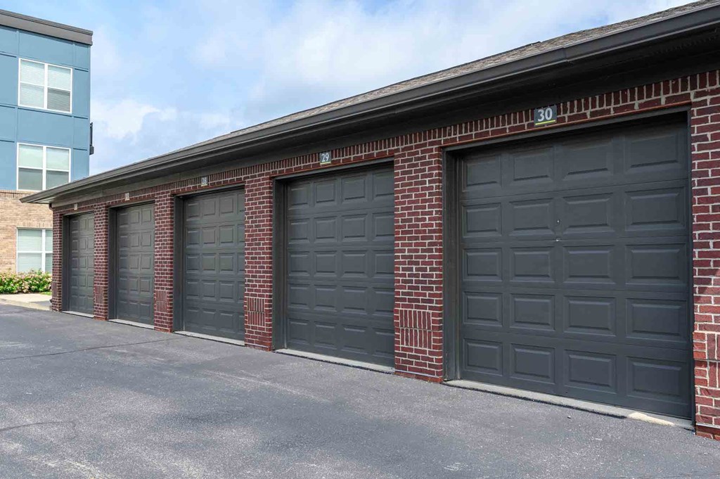 A row of black garage doors are closed.