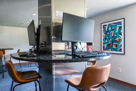 Business center with dual monitor workstations at The Falls Apartments, Kansas, 66202