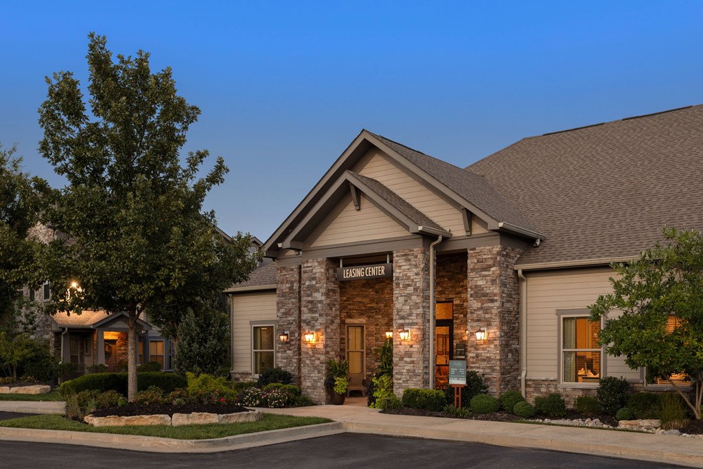 A building with a stone facade and a sign that reads "BONNEY" is shown.