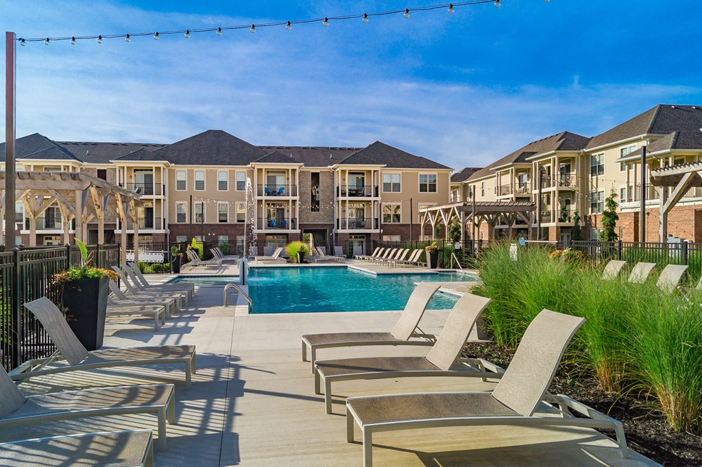 pool with lounge chairs on sundeck  at The Greyson, Hilliard, Ohio