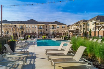 pool with lounge chairs on sundeck - Photo Gallery 2