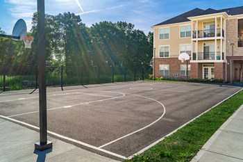 basketball court with building in background - Photo Gallery 12