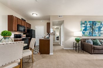 view of kitchen and living room from front door of apartment - Photo Gallery 42