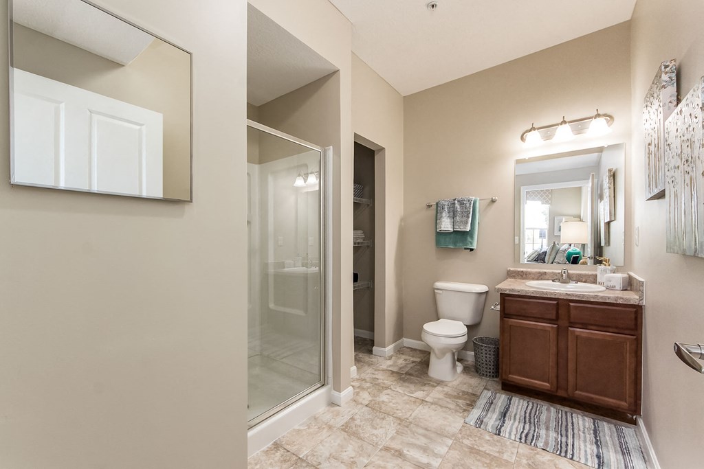 shower and sink vanity in bathroom at The Greyson, Hilliard