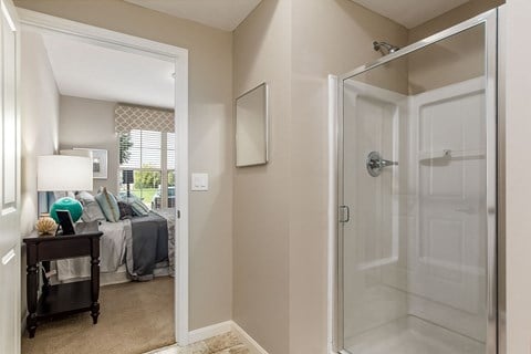 shower with view of bedroom at The Greyson, Hilliard, 43026