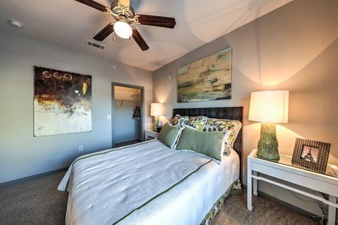 a bedroom with a bed and a ceiling fan  at Waterstone at Cinco Ranch, Katy, TX, 77450