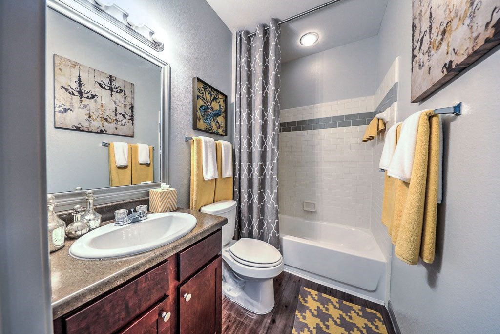 a bathroom with a toilet and a sink and a shower  at Waterstone at Cinco Ranch, Katy, Texas