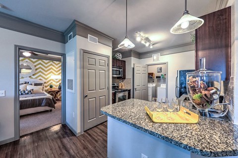 a kitchen with a counter top and a fish tank  at Waterstone at Cinco Ranch, Texas