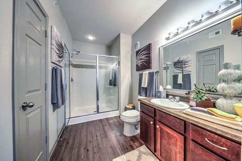 a bathroom with a shower toilet and sink  at Waterstone at Cinco Ranch, Katy, TX