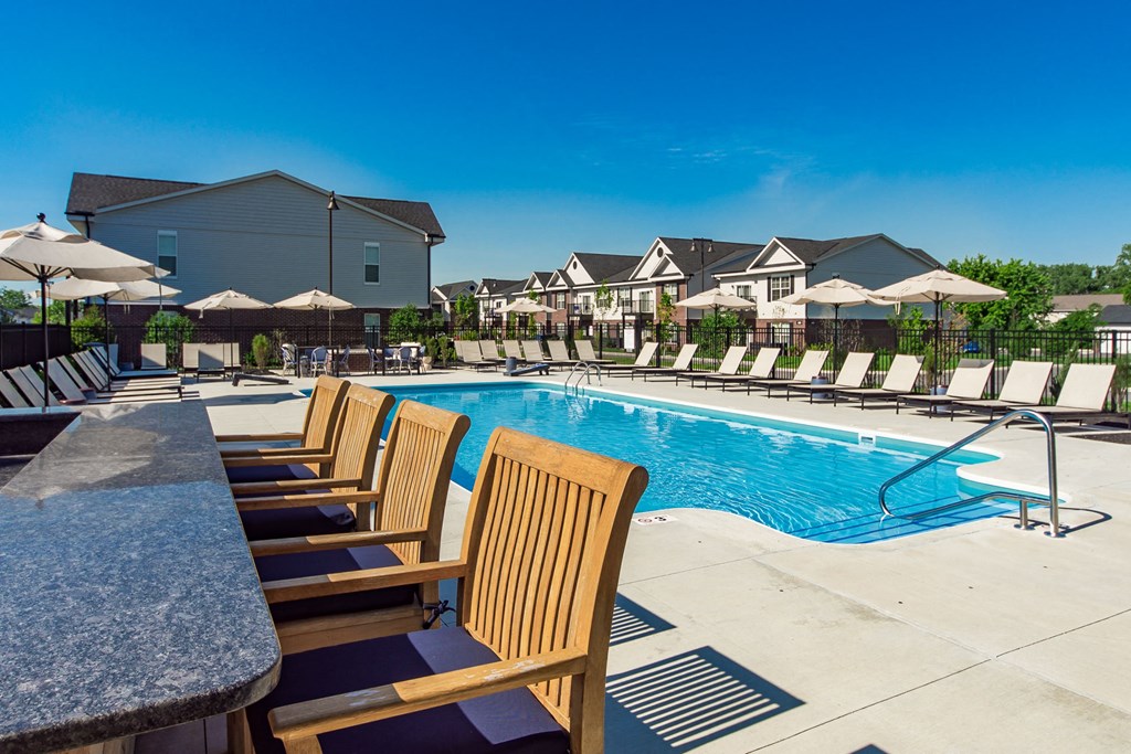 bar with chairs next to pool at Overland Park, Ohio