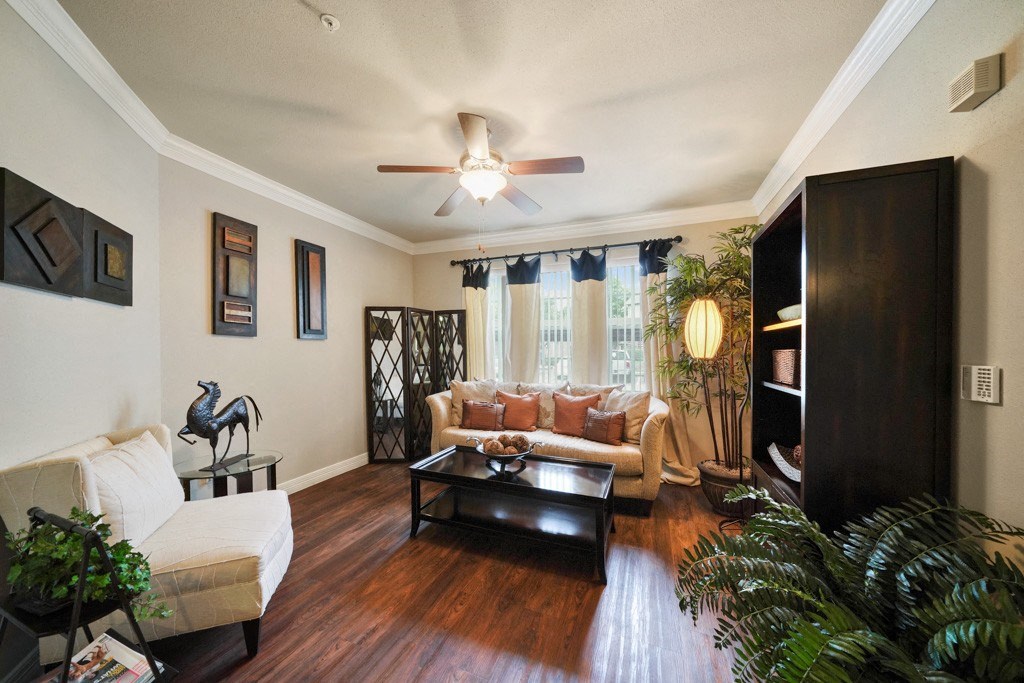 living area with wood flooring and natural light at River Pointe, Conroe, 77304