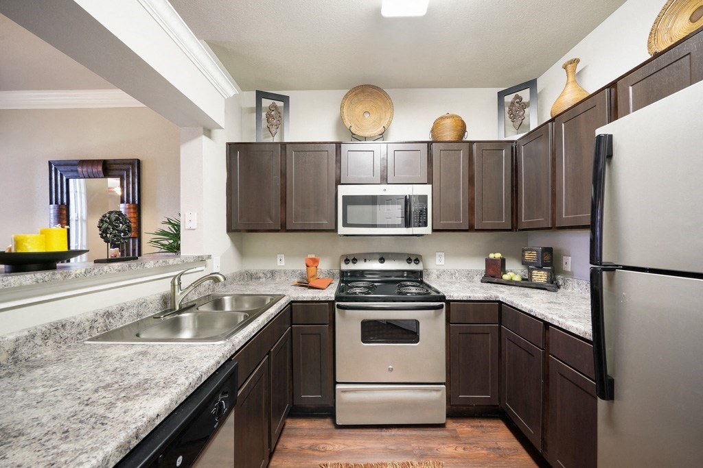 fully equipped kitchen with stainless steel appliances at River Pointe, Conroe, Texas
