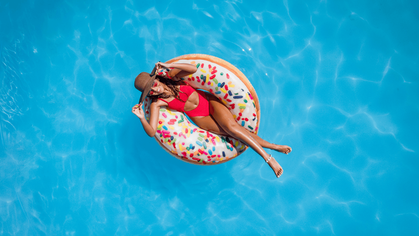 woman on inflatable donut in swimming pool - Photo Gallery