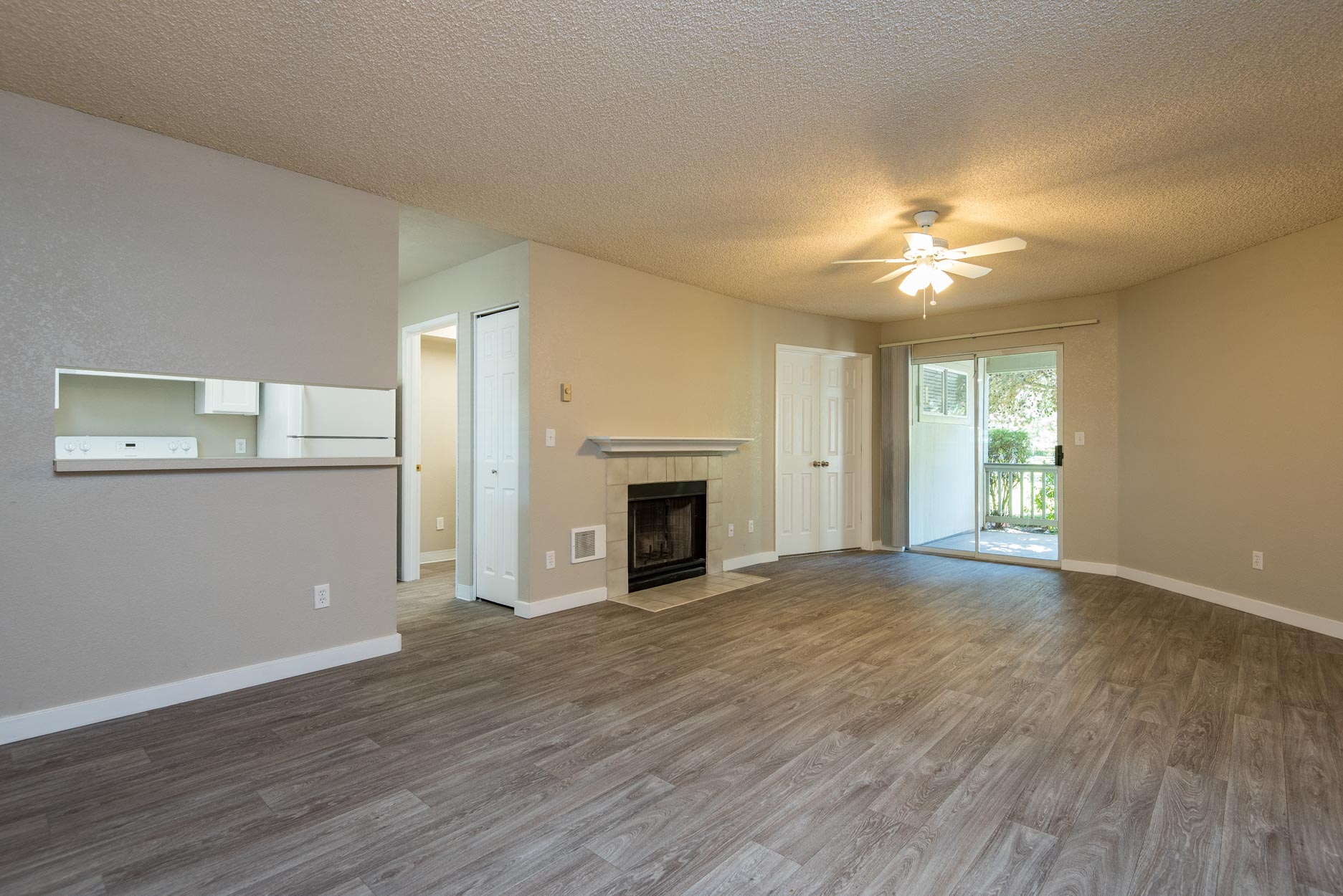 Three Bedroom | Living Room with Fireplace and Patio