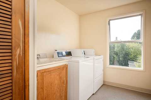 A laundry room with a washer and dryer.