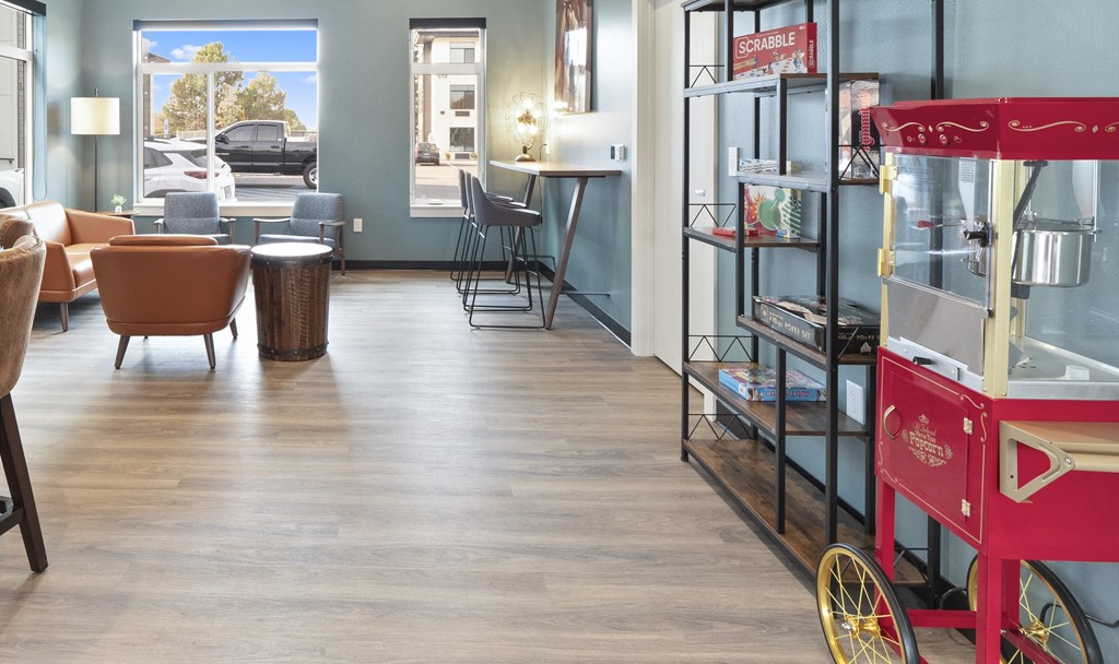 a room with a red cart in the center of it