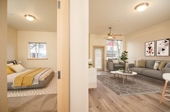 Fairview Village | Split View of Living Area and Bedroom - Photo Gallery 3