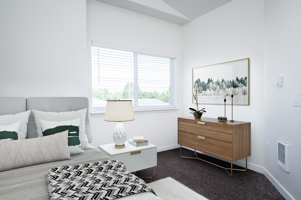 a bedroom with a bed and a dresser with a lamp and a painting on the wall