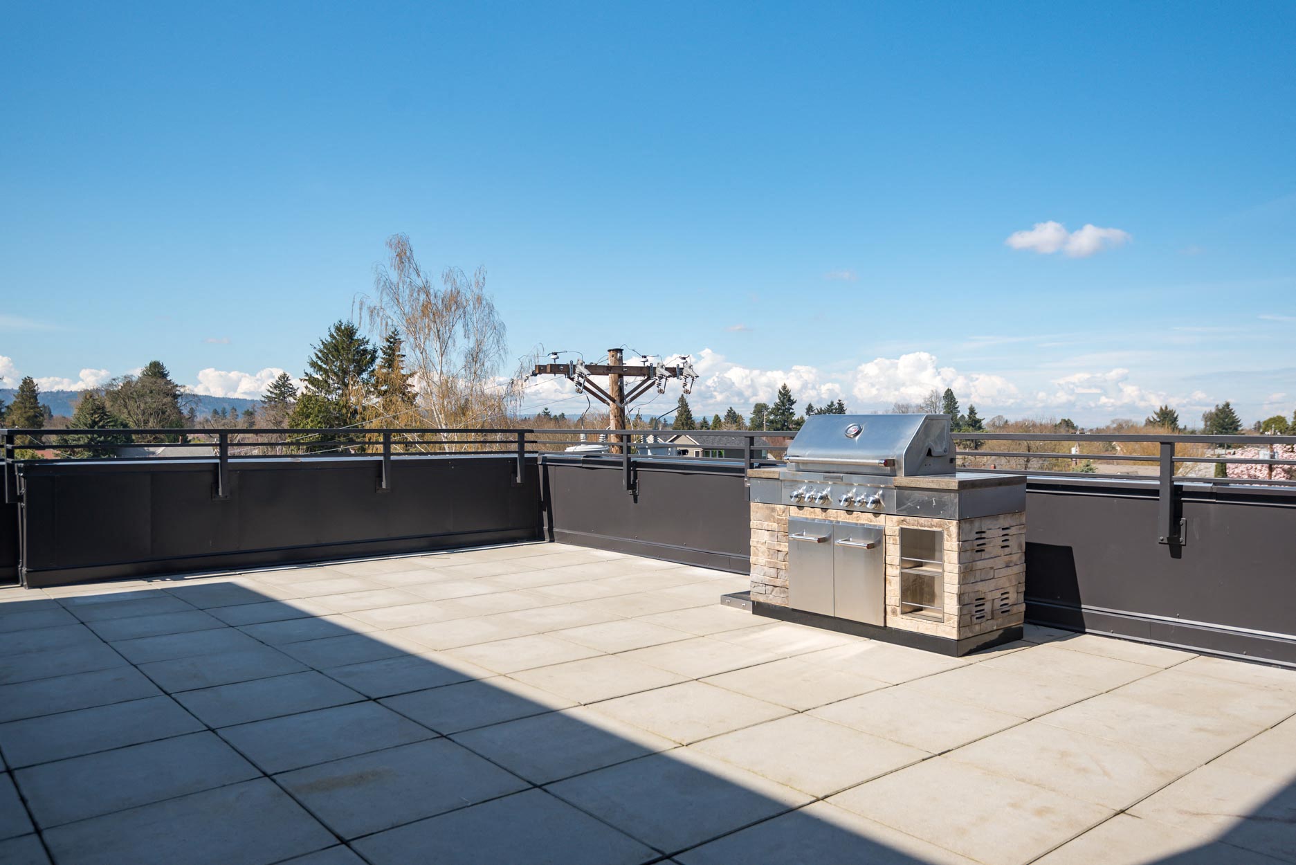 Slogan Apartments | Roof top BBQ Area
