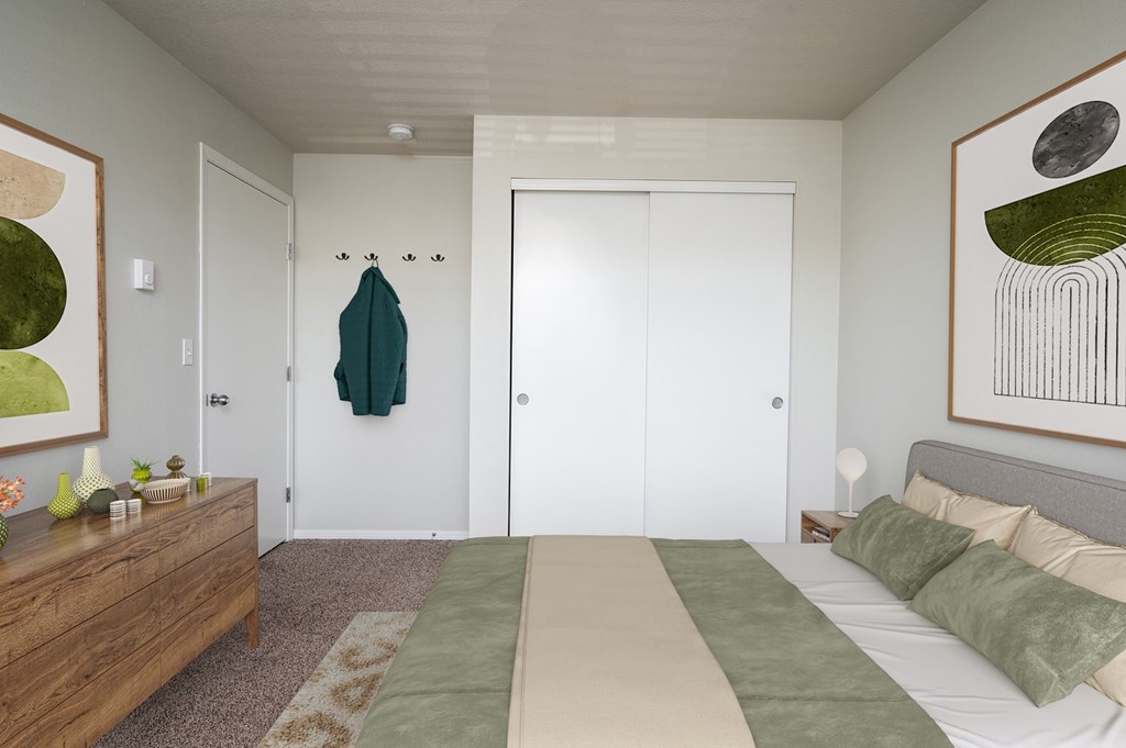 A bedroom with a bed, dresser, and two paintings on the wall.