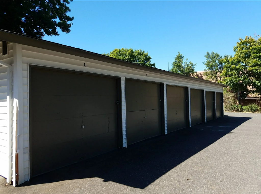 a row of garage doors on the side of a building