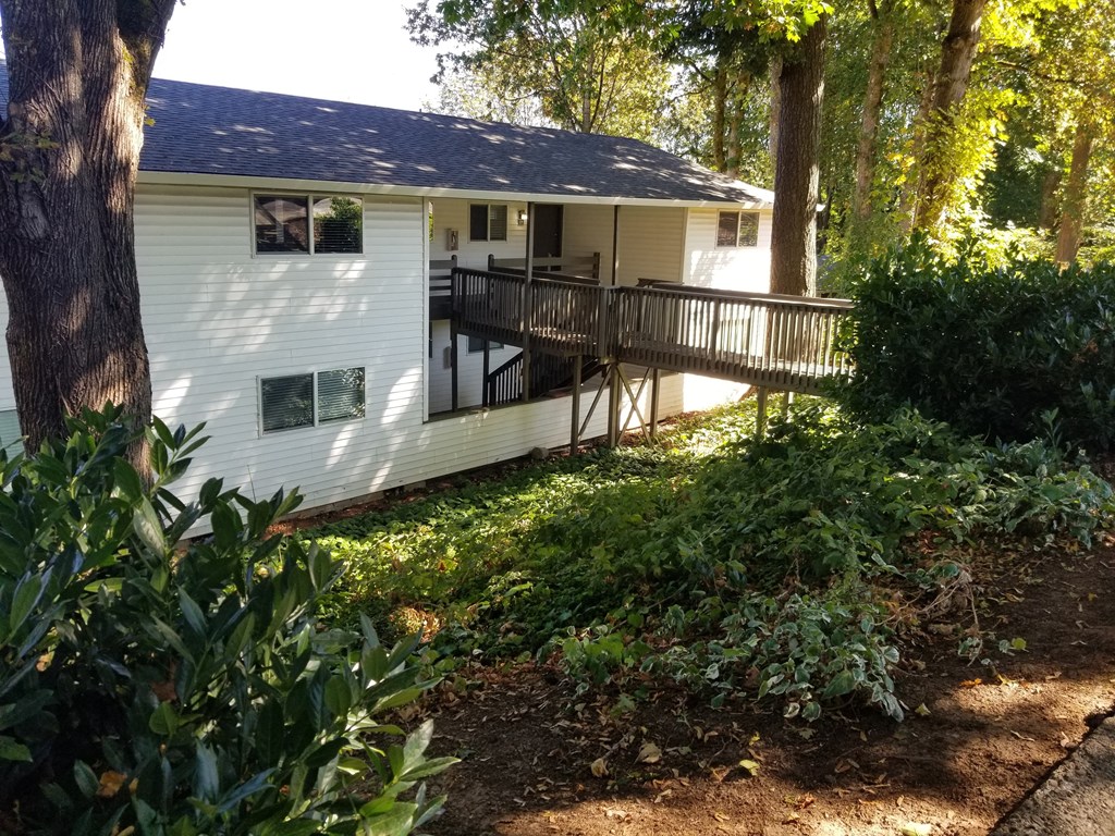the back of our house with a deck