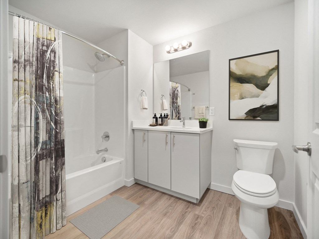 a bathroom with a shower toilet and sink