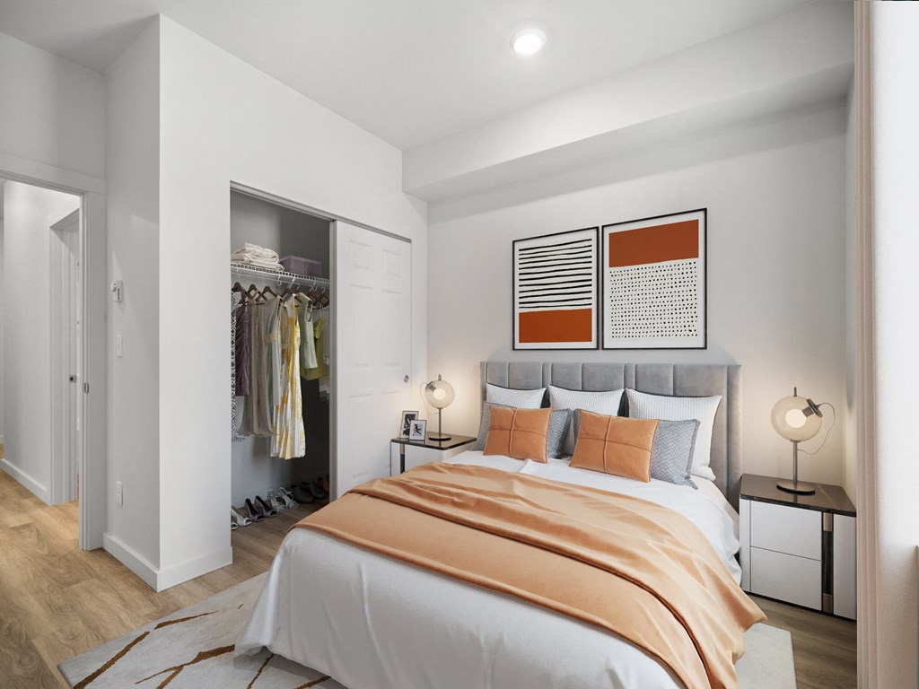 a bedroom with a bed and a closet