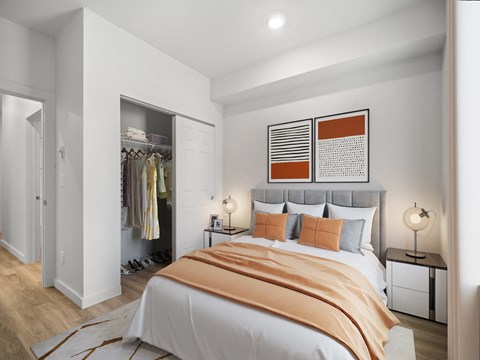 a bedroom with a bed and a closet