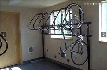 a bike rack on the wall of a room
