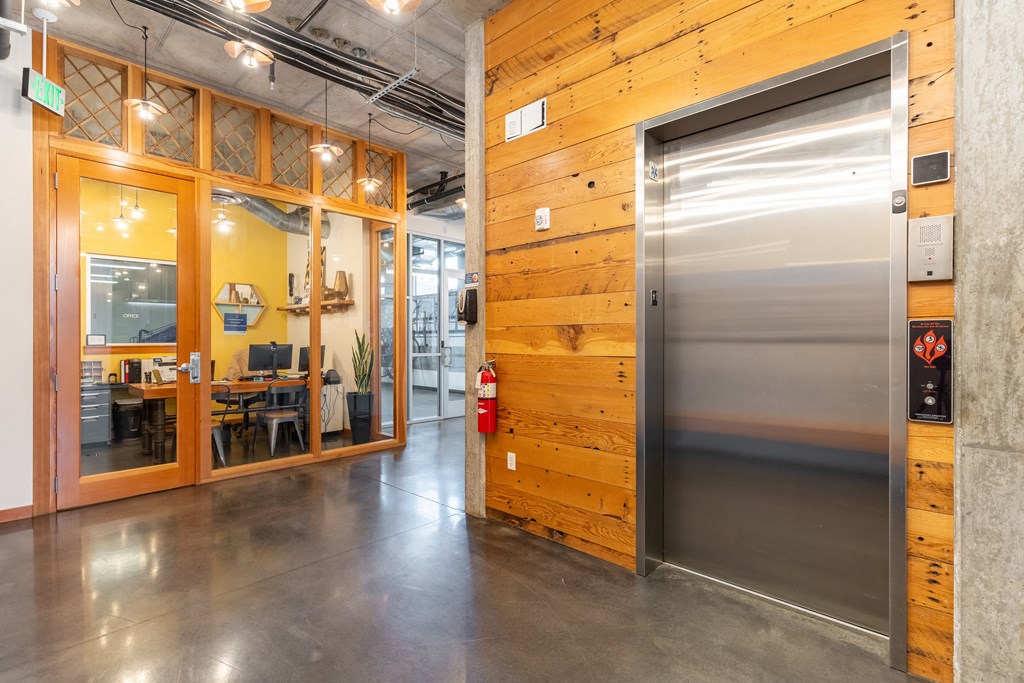 a large stainless steel refrigerator in a room with a door
