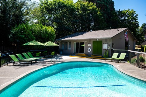 a house with a swimming pool in front of it