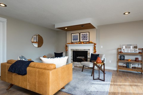 a living room with a couch and a fireplace