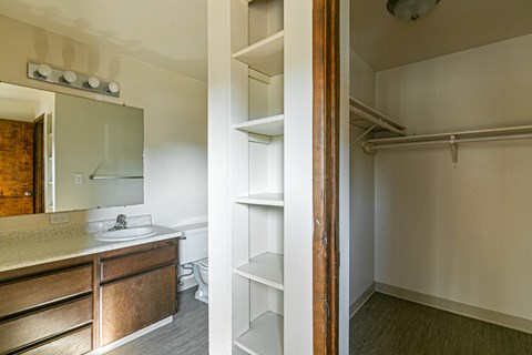 A bathroom with a sink and a mirror.