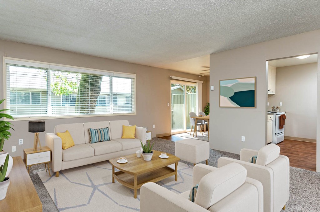 a living room with couches and chairs and a table