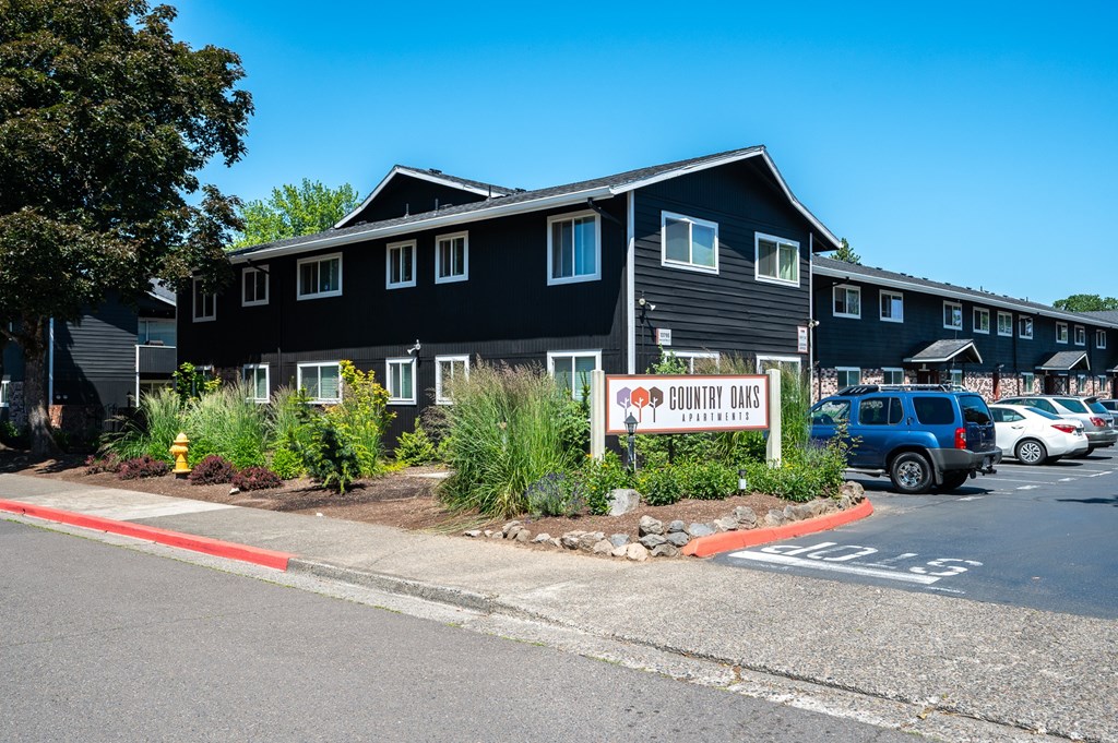 A black building with a sign that says