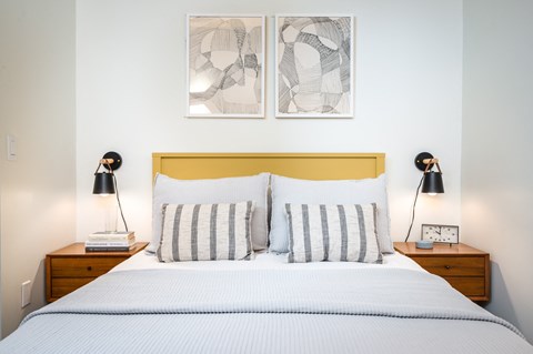 Studio Apartments in Eugene OR - Crosswood Apartments - Bedroom with White Walls, Plush Bed, and Two Night Stands