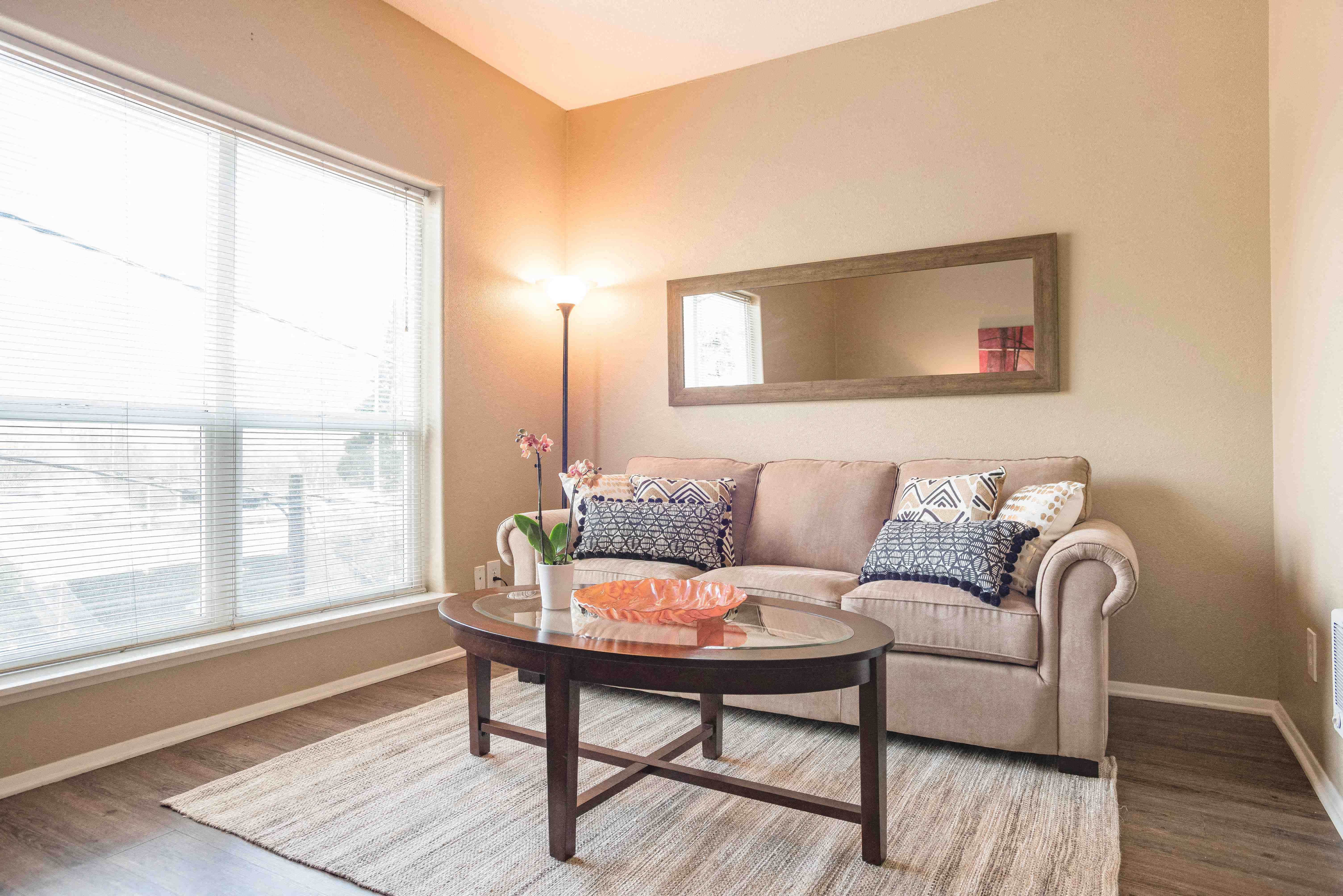 a living room with a couch and a table