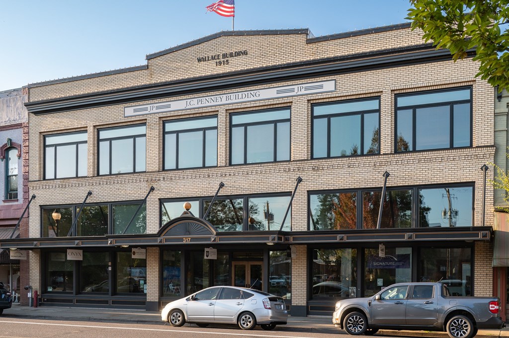 A building with a sign that says "Le Penney Building" on it.