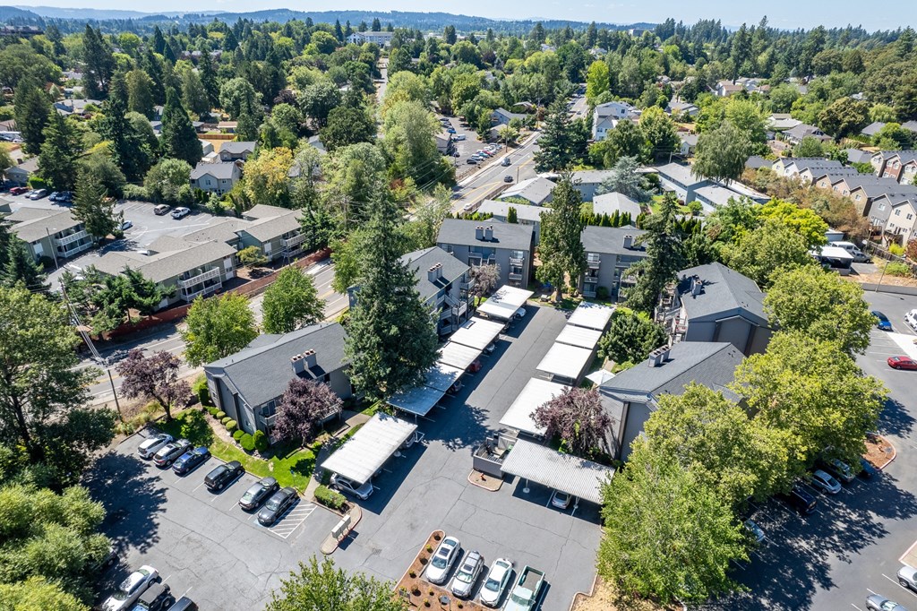arial view of the campus with buildings and cars parked in the parking lot