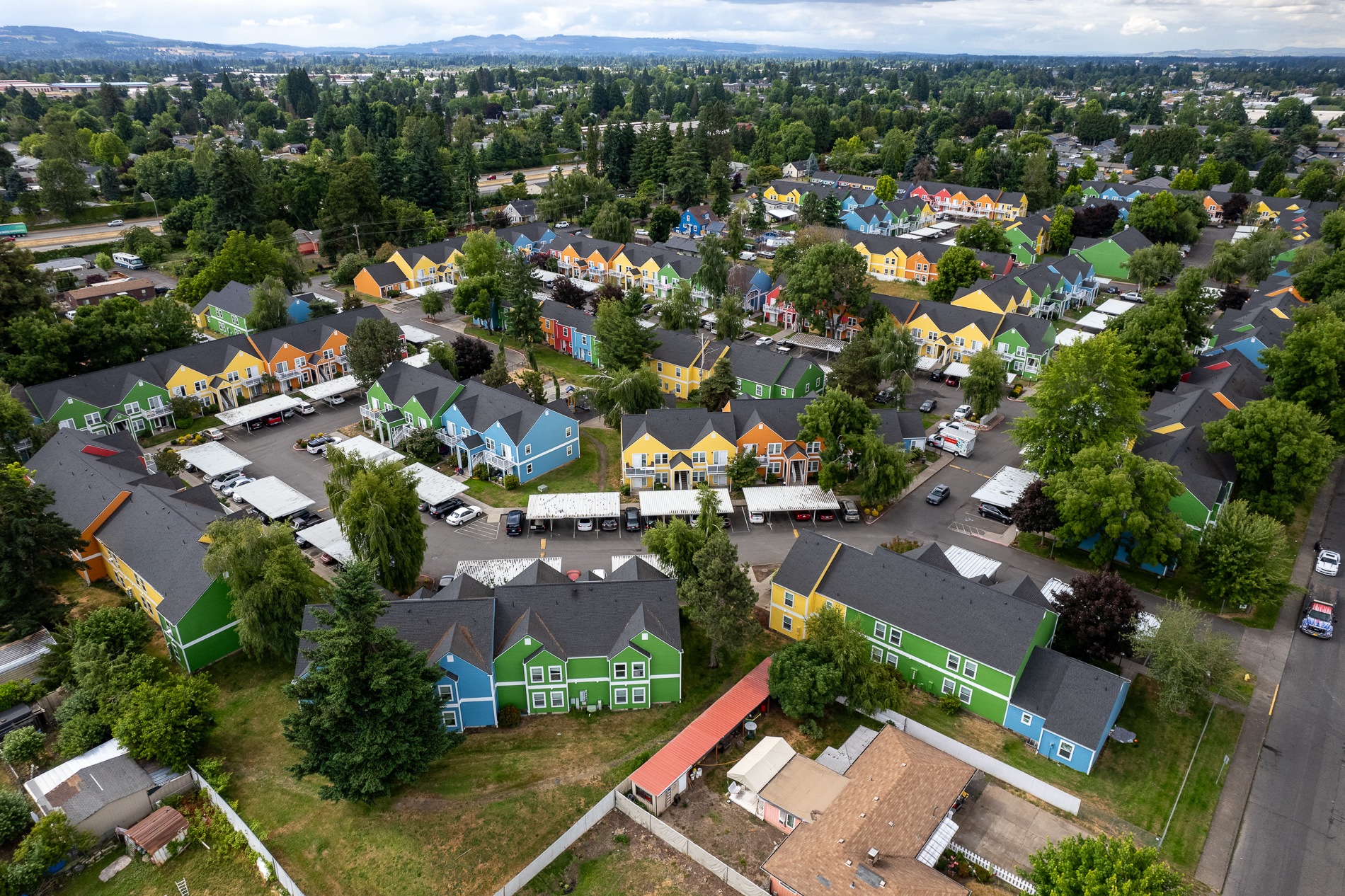 a birdseye view of a neighborhood with colorful houses