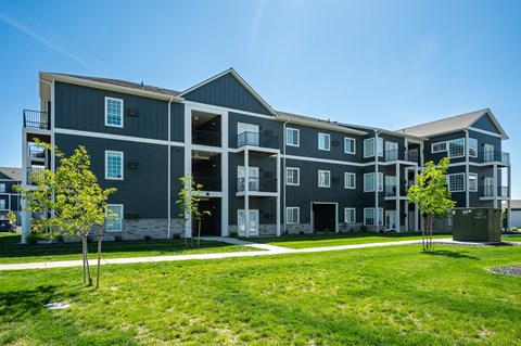 A large building with a balcony on the second floor.