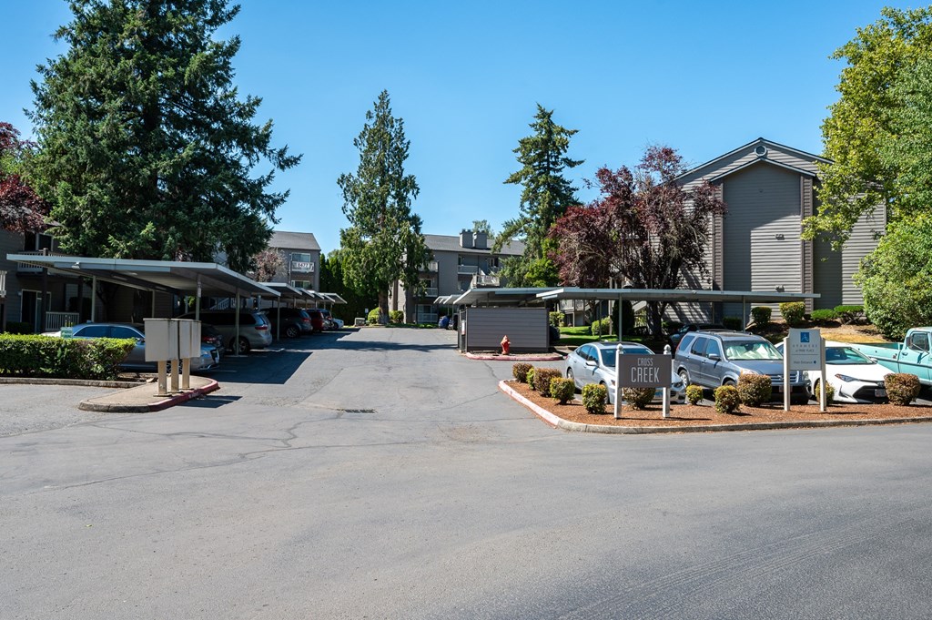 a parking lot at the whispering winds apartments in pearland, tx