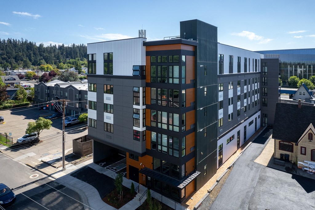 an aerial view of a modern building in a city