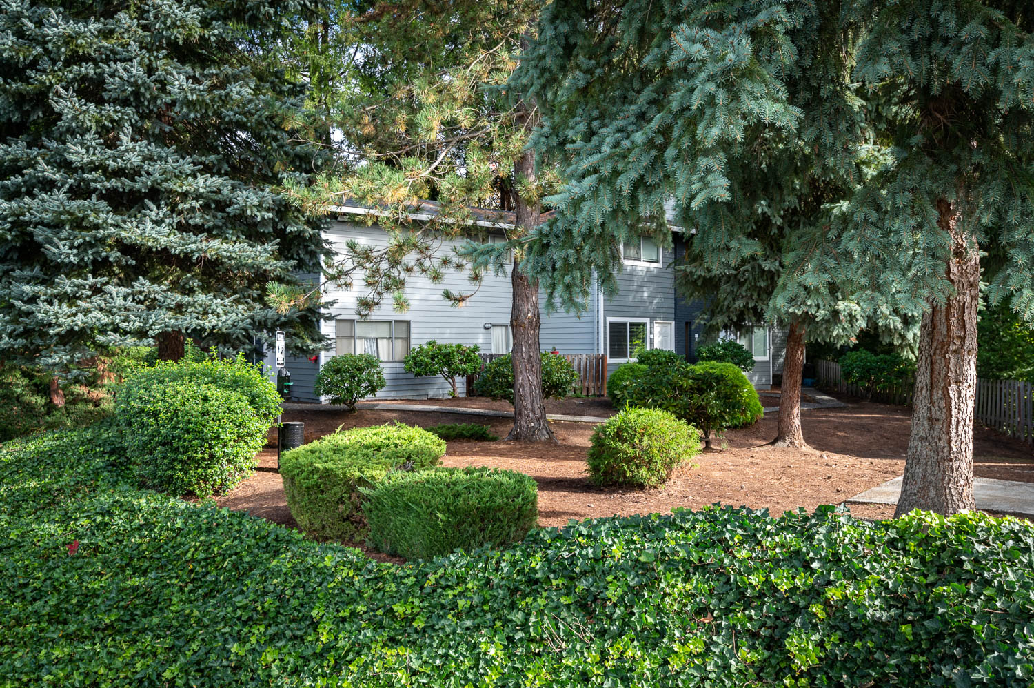 The Hideaway | Exterior Building with Mature Landscaping