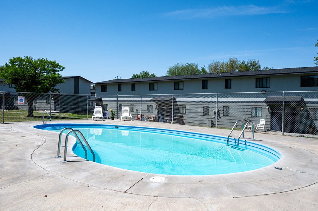 A small pool with a metal ladder.