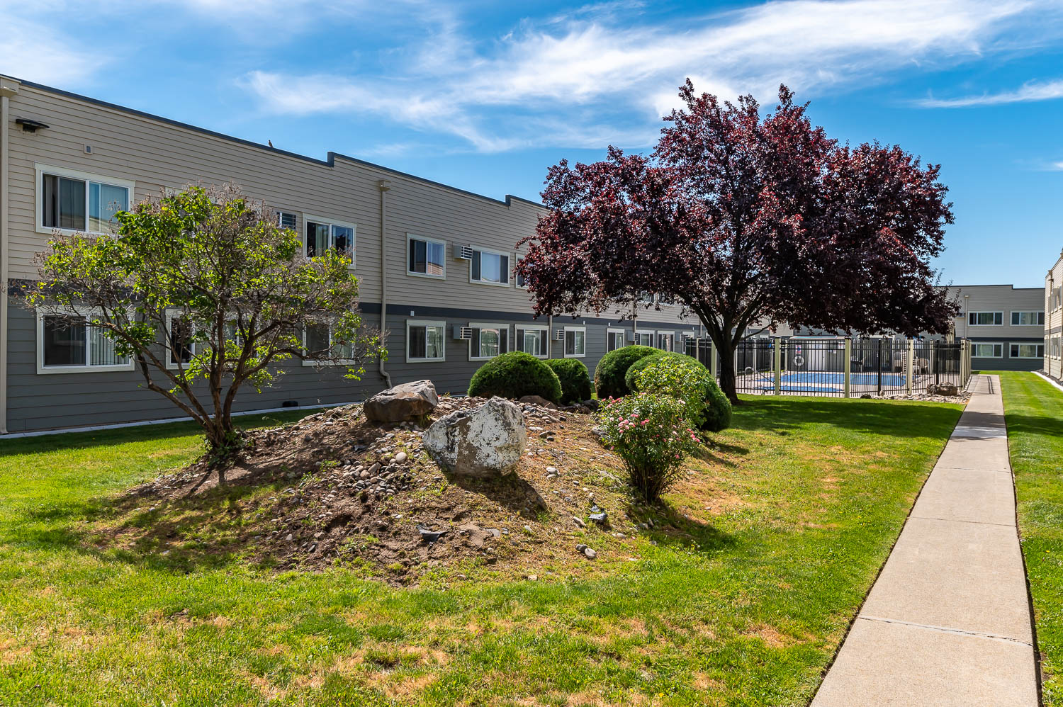 Americana | Outdoor Pool, Exterior Building and Walkway